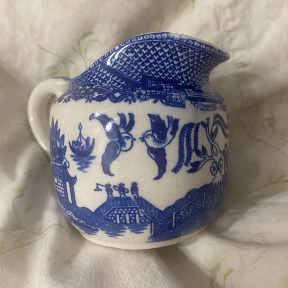 Unusual small blue & white painted creamer cup